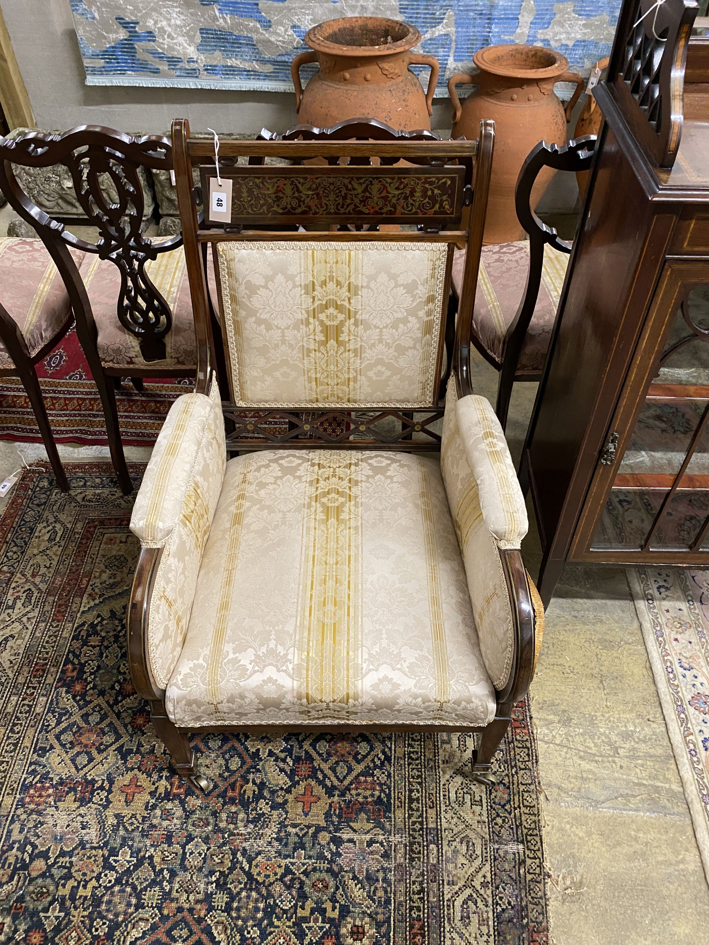 An Edwardian brass inlaid and boulle work rosewood upholstered armchair, width 60cm, depth 60cm, height 96cm